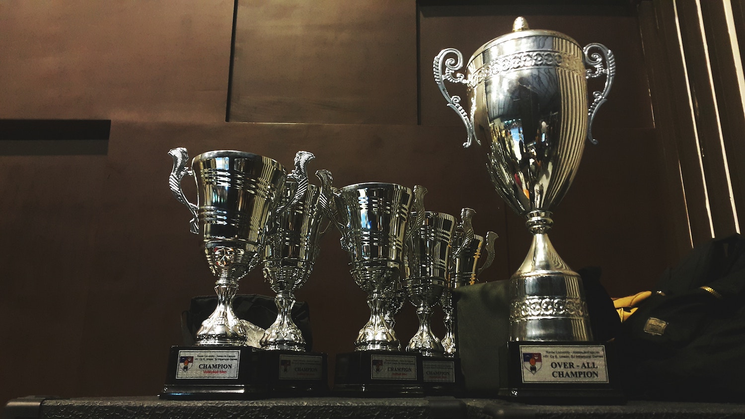 A row of silver champion trophy cups