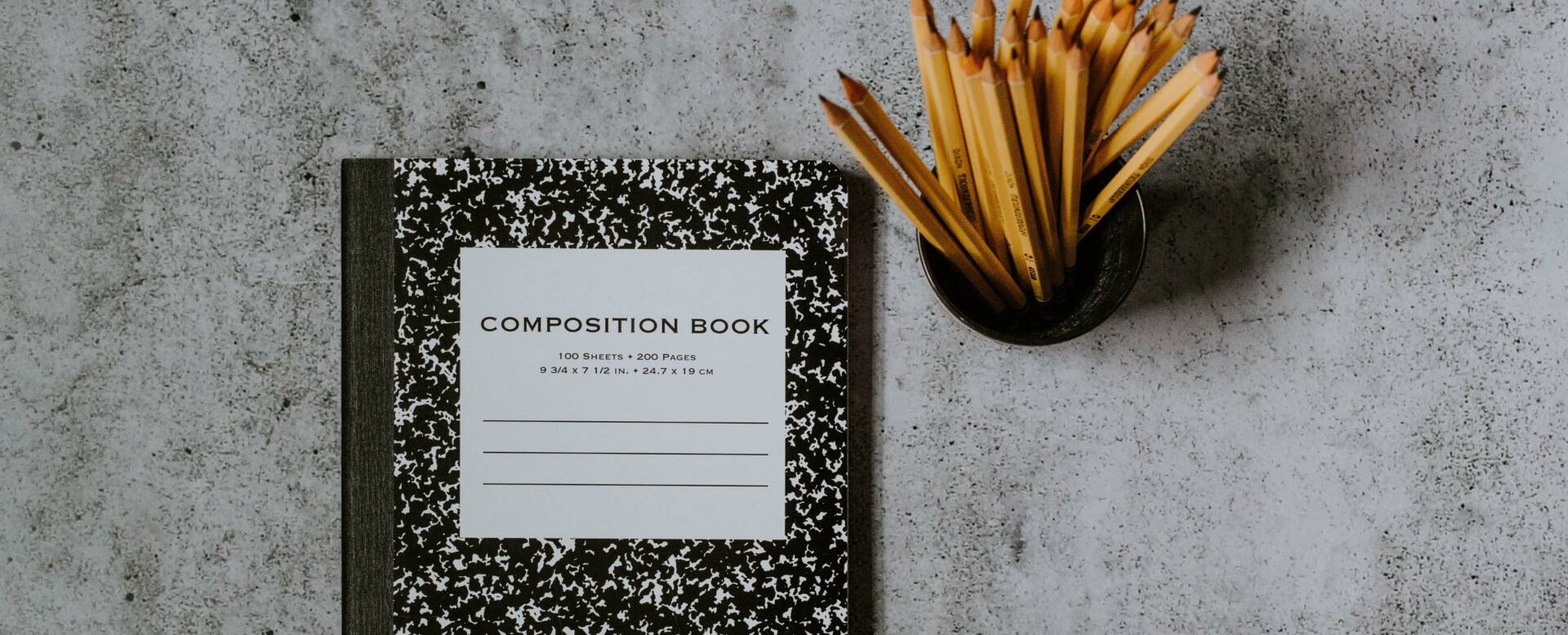 composition book and pencils